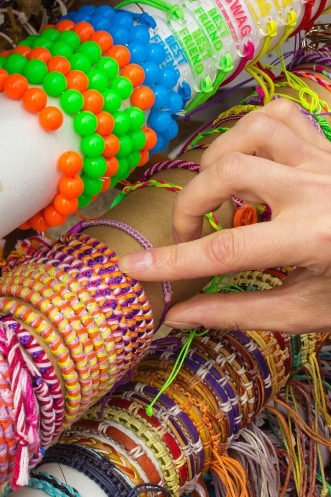 hand of woman with colorful bracelets shopping je 2025 10 16 23 34 26 utc e1773141246999