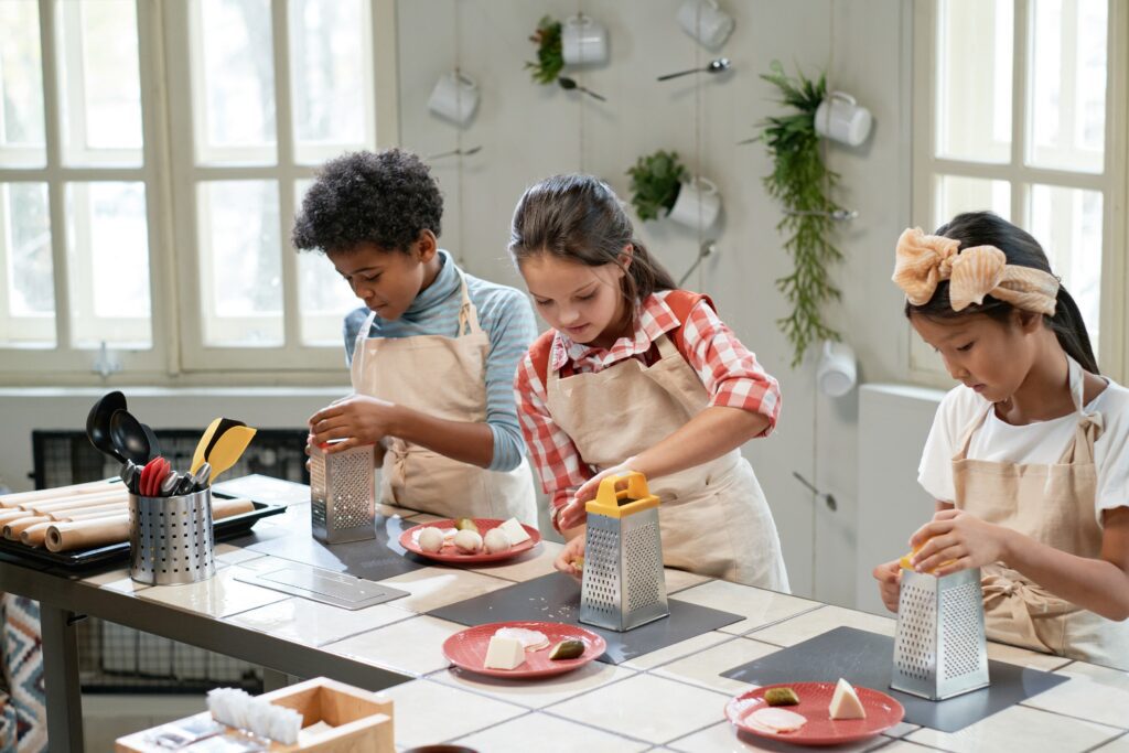 children rubbing cheese on pizza 2026 01 08 00 15 11 utc