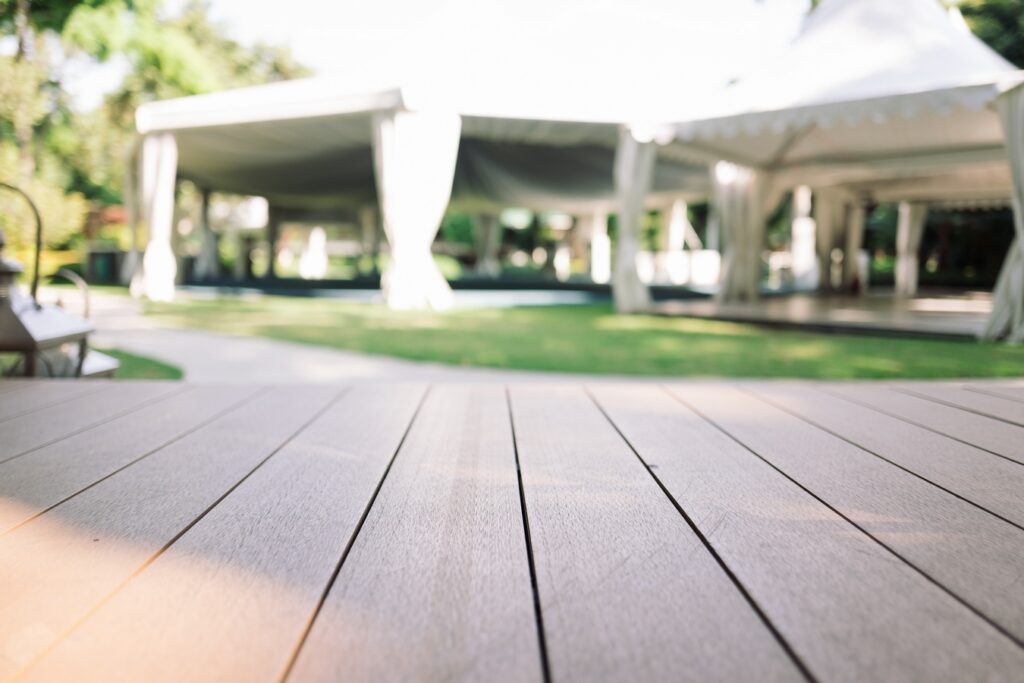 empty wooden floor with white tent and garden on t 2026 01 06 10 39 21 utc