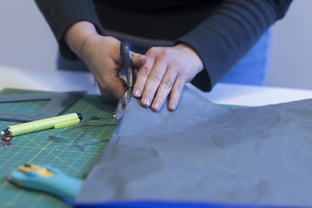 hands meticulously cutting fabric on a cutting mat 2026 01 09 09 50 41 utc