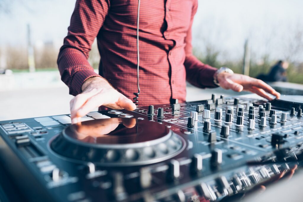 young man using mixing desk at roof party mid sec 2026 01 09 08 28 34 utc